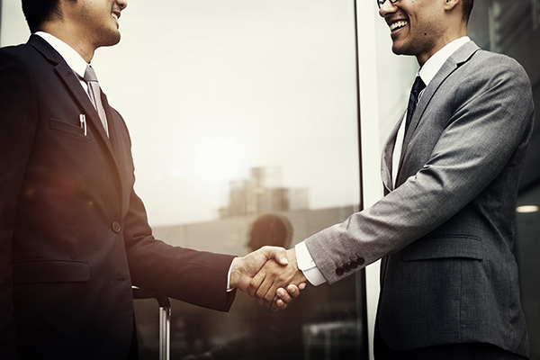 Corporate businessmen shaking hands